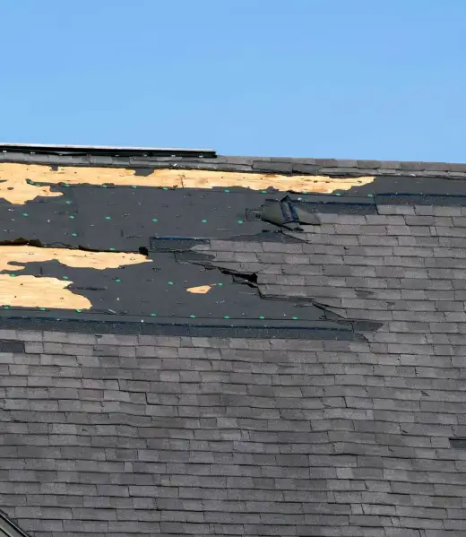 Consequences,Of,Natural,Disaster.,Damaged,House,Roof,With,Missing,Shingles